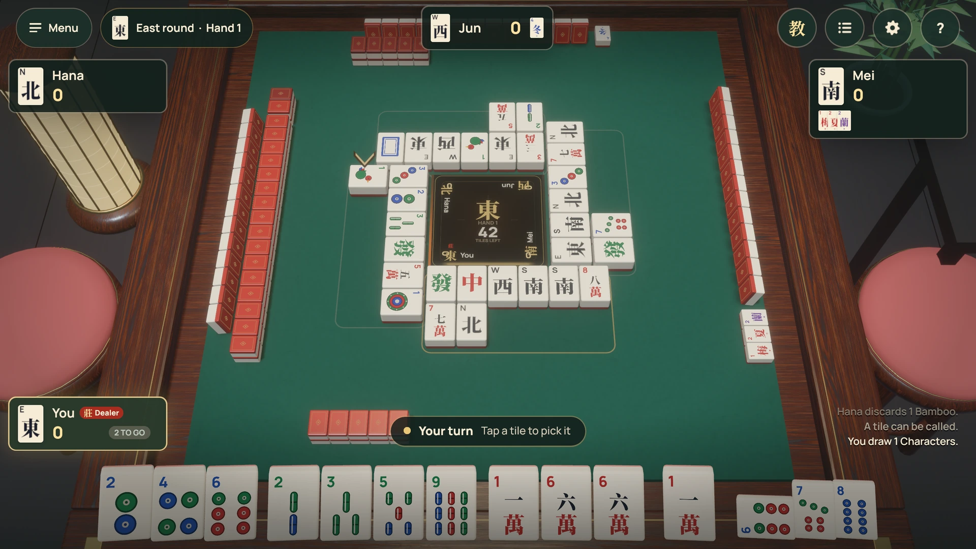 Hello Mahjong’s Hong Kong game: an ivory tile rack, red-backed walls and discards around the centre of a green 3D table. Fixture players Hana, Jun and Mei sit opposite you.
